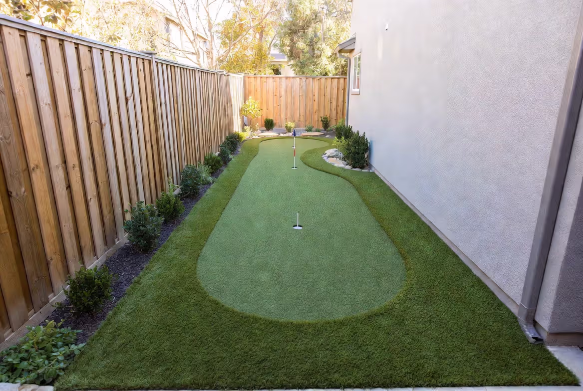 side yard transformed into a narrow residential putting green